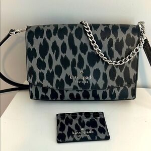Kate spade crossbody bag in black and gray print with small credit card pouch.